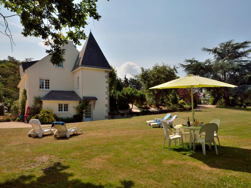 Sky, Plant, Building, Tree, Land Lot, Shade, Table, Grass, Outdoor Furniture, Cloud