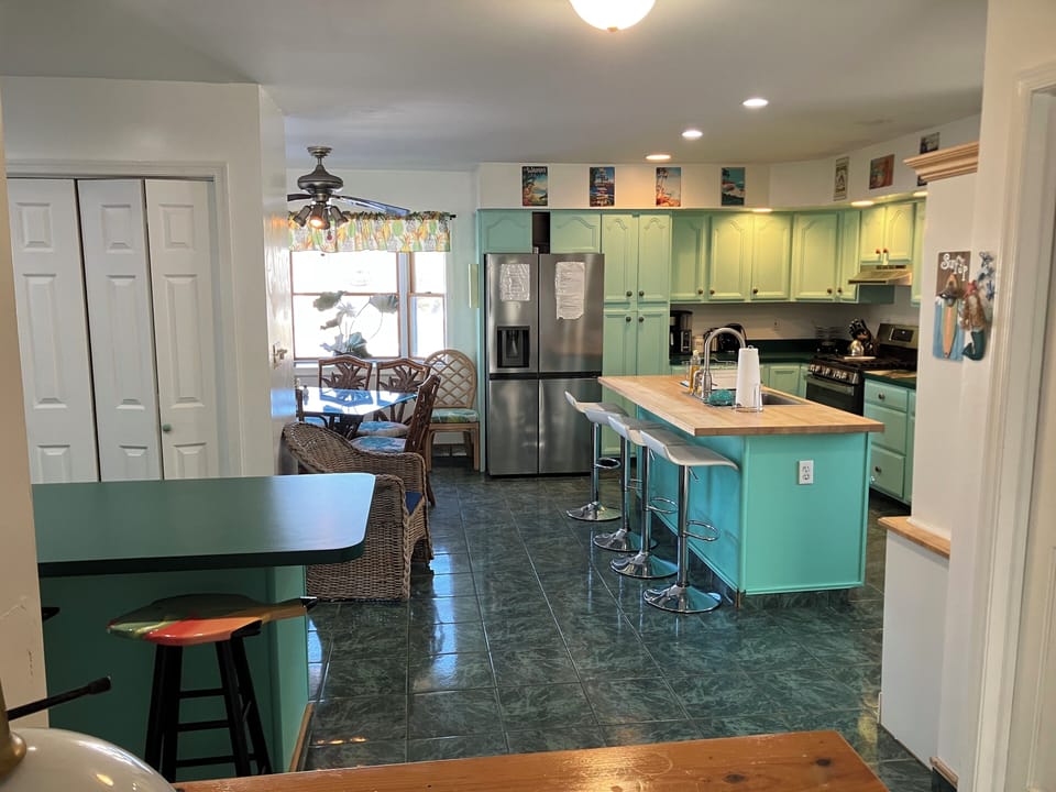 Large eat in kitchen with 2 islands and kitchen table to seat everyone.
