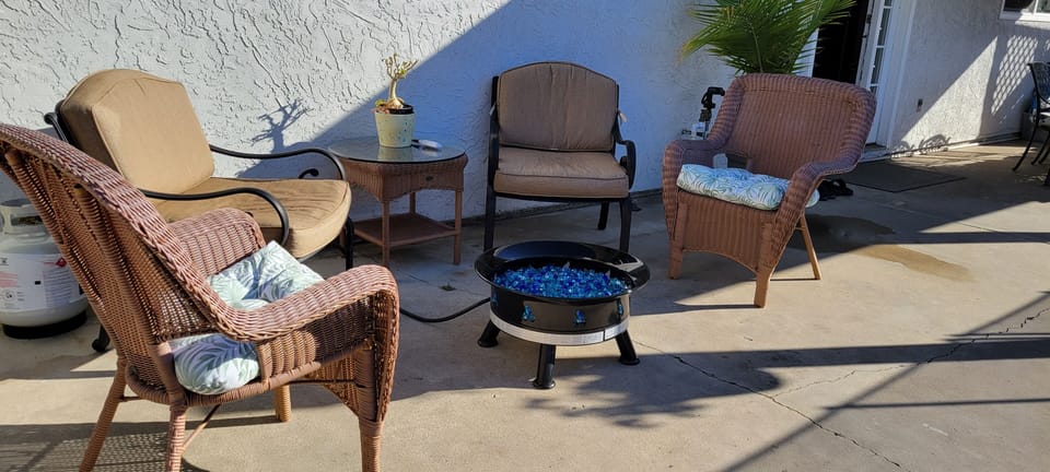 Portable propane fire pit. An extra propane tank is provided.