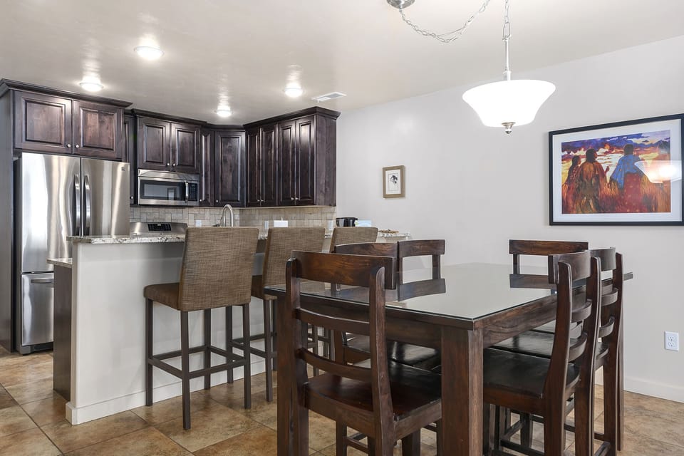 Plenty of seating at the dining table or bar