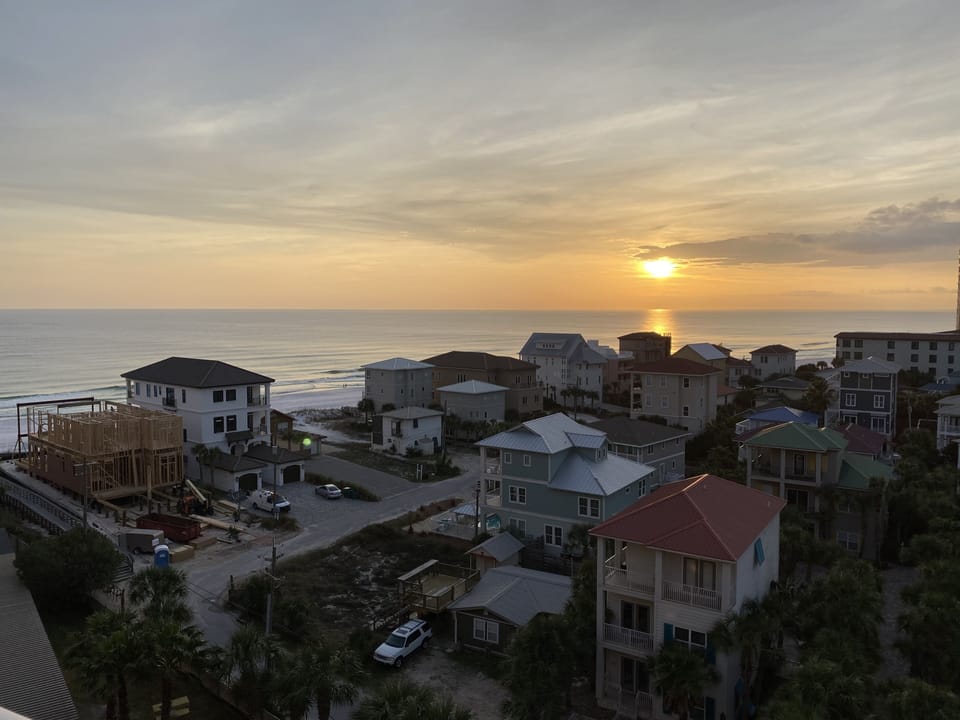 End a day at the beach by watching the sunset  on your own balcony 