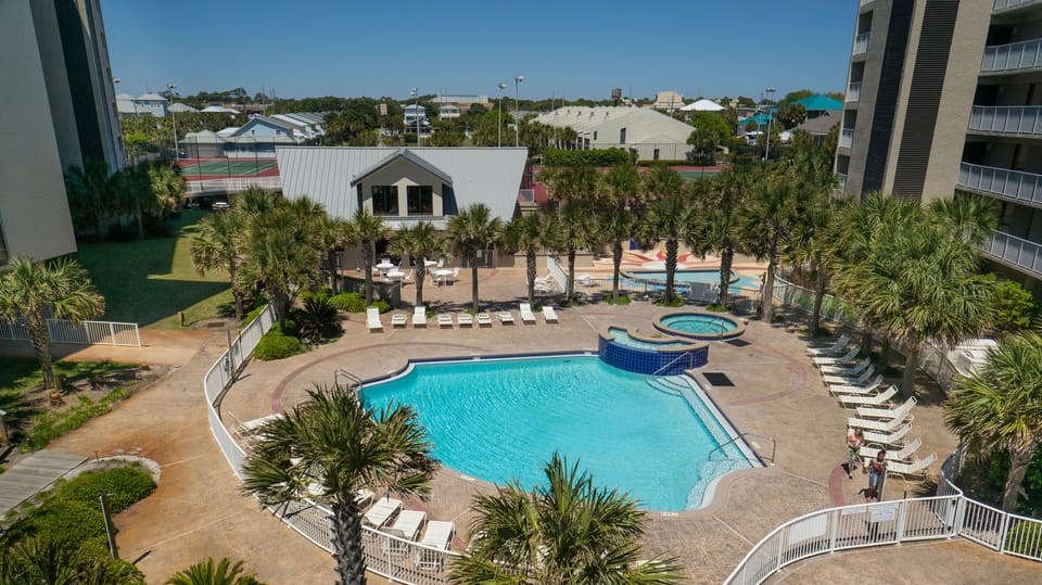 One of two pools on property, plus splash pad, hot tub, and multiple gas grills