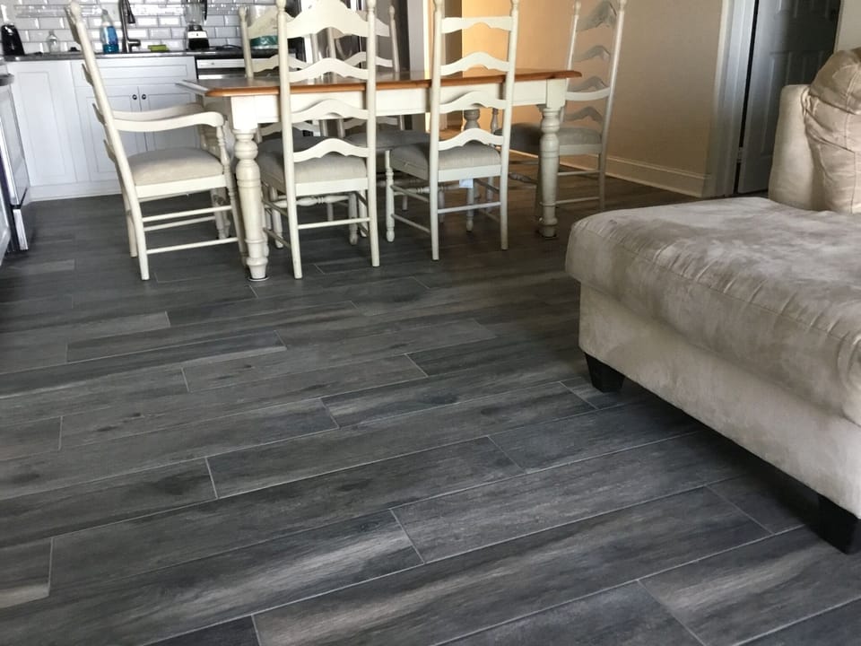 new flooring between dinning room area and living room (no more bump at carpet)