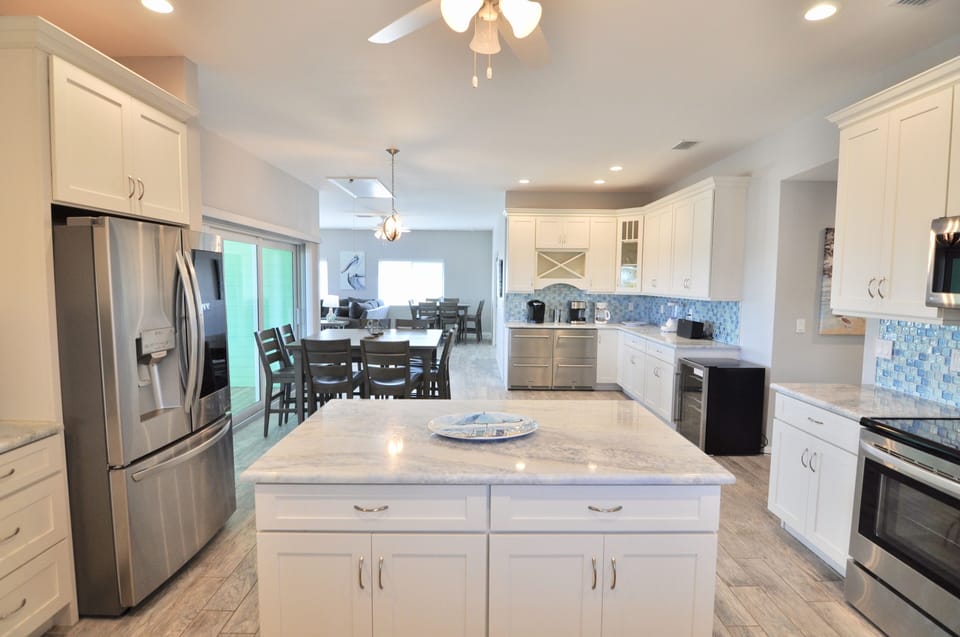 Kitchen, sea glass back splash, full size fridge, 2 commercial drawer fridges