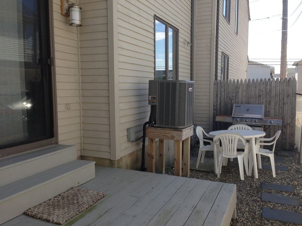 Rear deck with table, chairs and gas grill