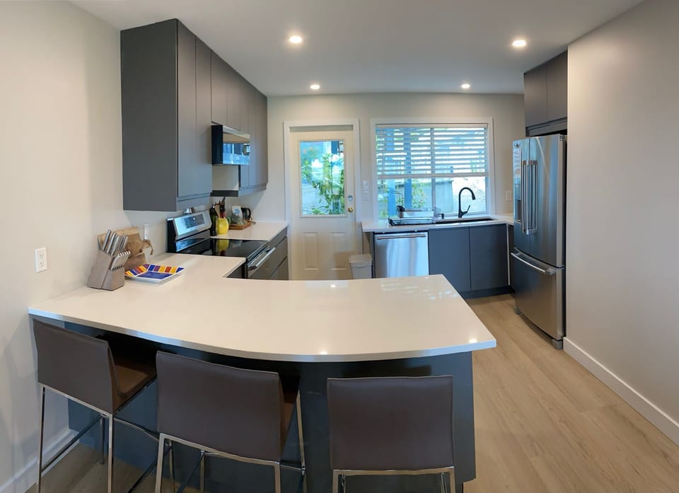 Newly renovated kitchen, bar area.