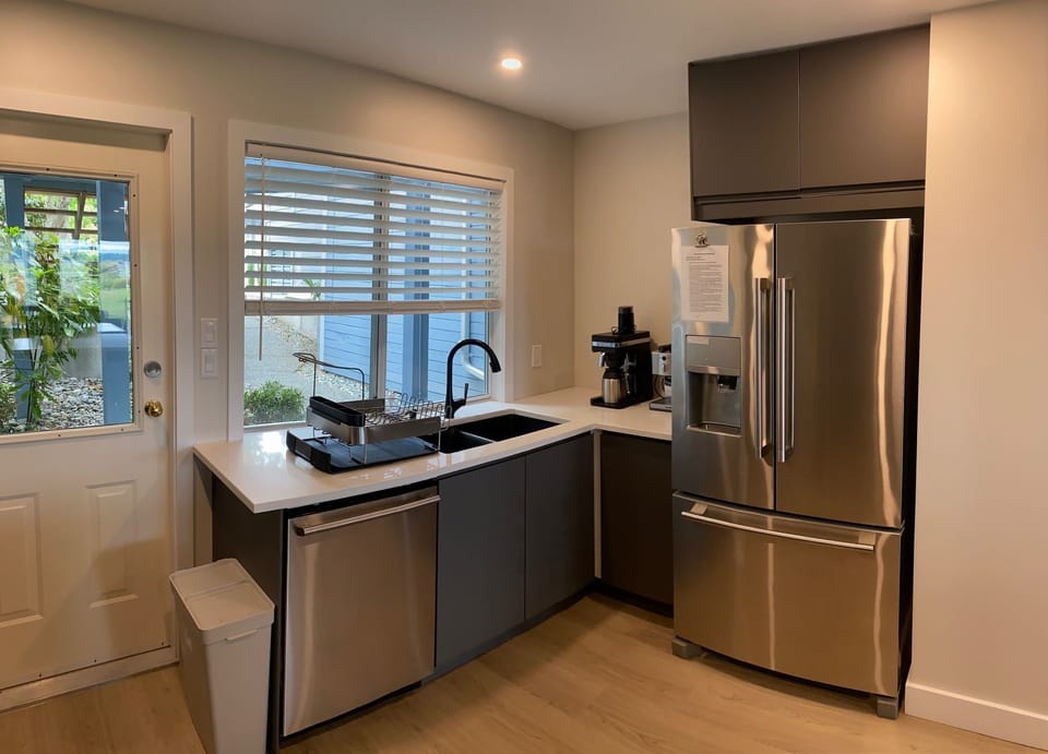 New double sink, fridge and coffee space.