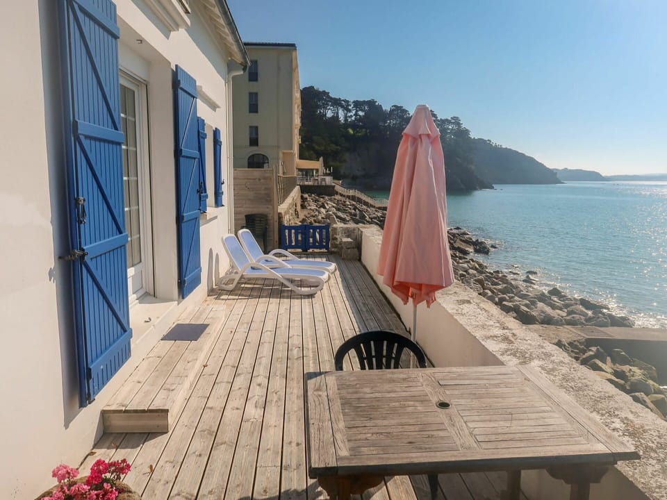 Water, Sky, Furniture, Building, Azure, Plant, Wood, Outdoor Furniture, Chair, Cottage