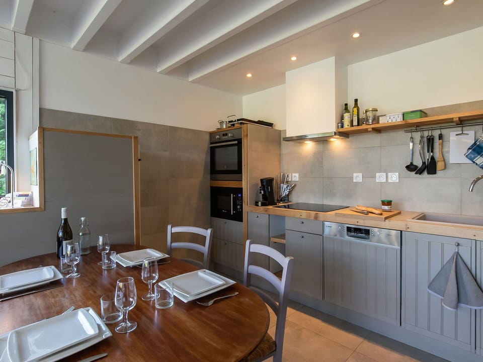 Table, Furniture, Cabinetry, Tableware, Countertop, Building, Wood, Interior Design, Flooring, Chair