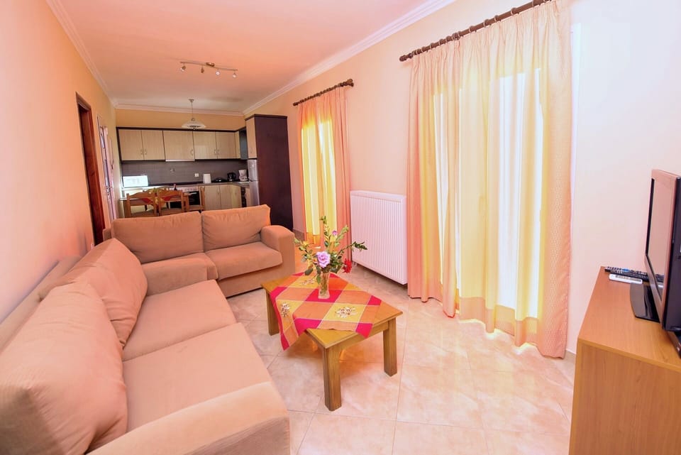 The sitting area features an open-plan layout together with the kitchen