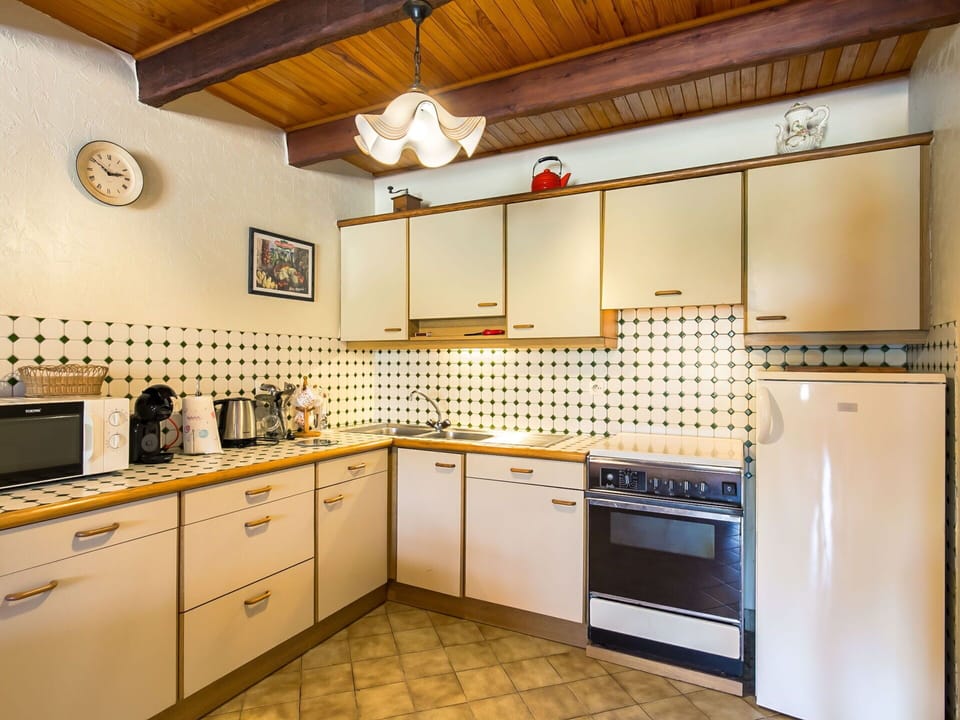 Cabinetry, Countertop, Kitchen, Sink, Kitchen Stove, Kitchen Appliance, Wood, Lighting, Major Appliance, Flooring