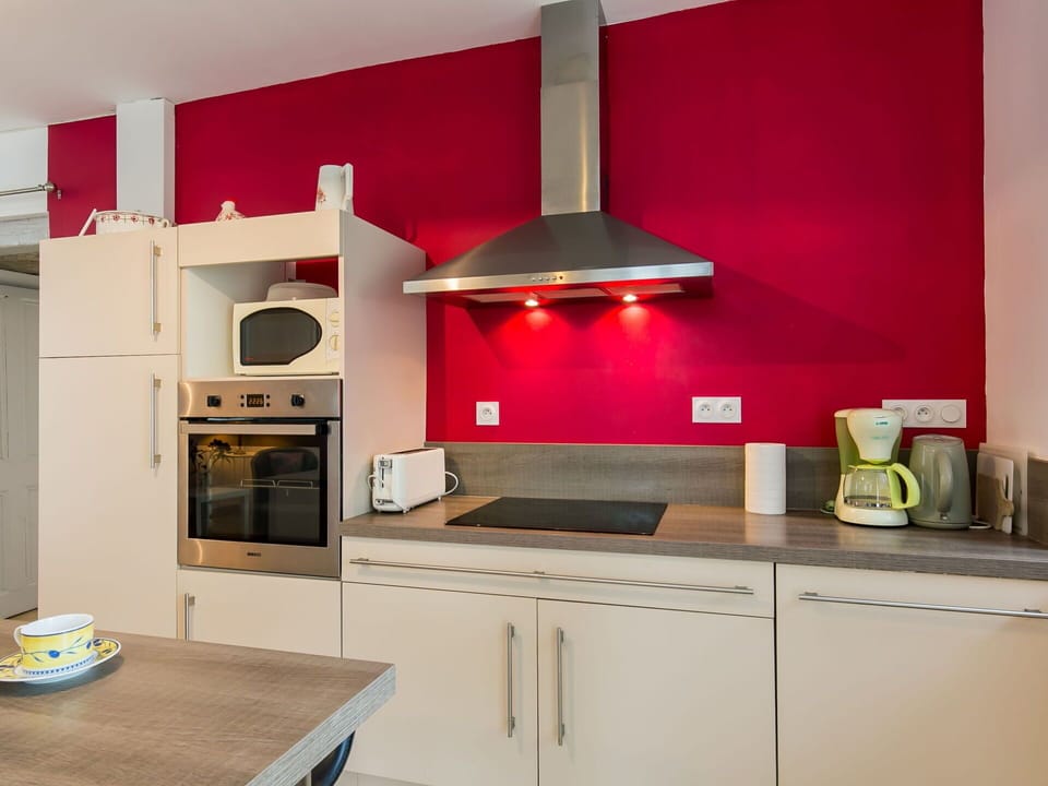 Cabinetry, Property, Countertop, Wood, Kitchen, Building, Kitchen Stove, Orange, Lighting, Interior Design