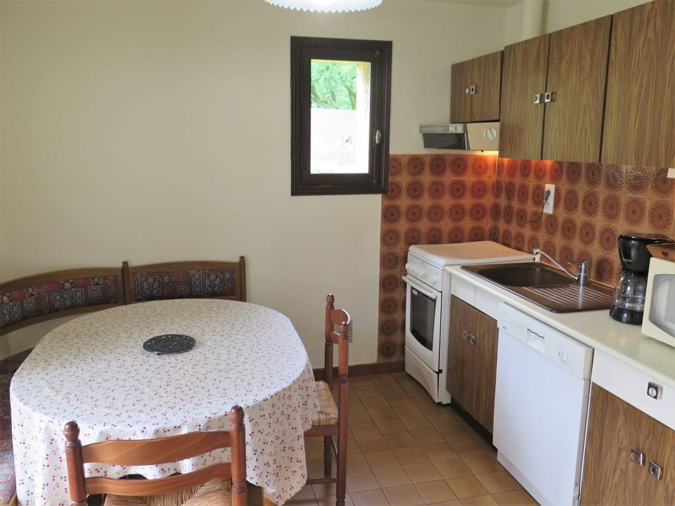 Cabinetry, Furniture, Property, Countertop, Sink, Table, Kitchen Appliance, Kitchen Stove, Building, Wood