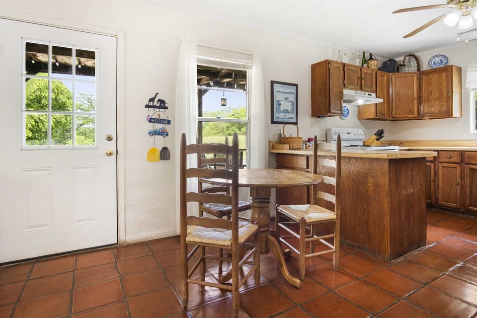 Charming breakfast nook with rustic wood accents and scenic views, perfect for a cozy morning coffee.