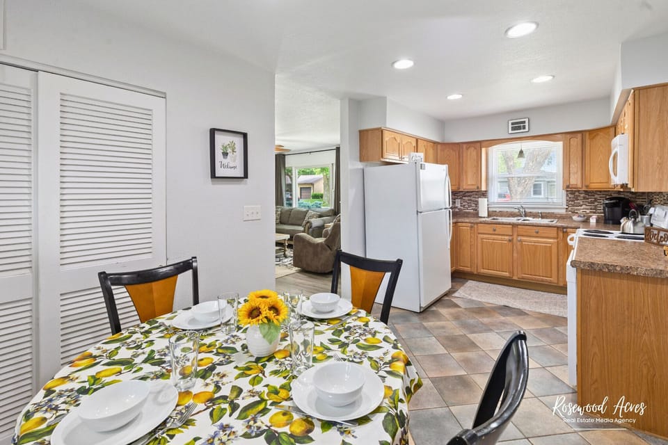 Eat in kitchen with four chairs extra chairs in closet