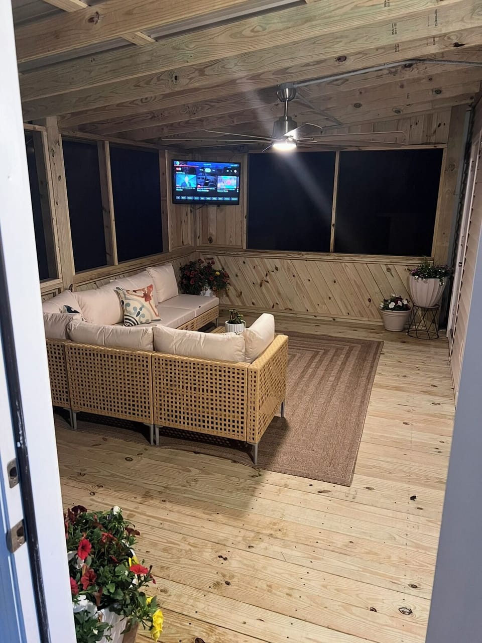 Outdoor screened porch with TV and surround sound