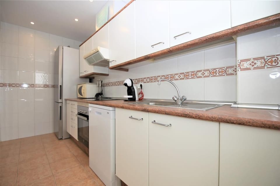 View of the fully equipped kitchen from another angle