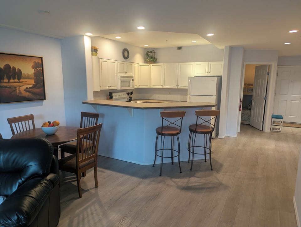 There is extra seating at the kitchen island with the two bar stools