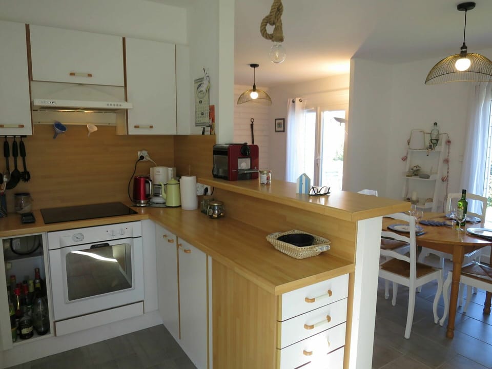 Cabinetry, Furniture, Property, Kitchen Sink, Countertop, Wood, Table, Kitchen Stove, Kitchen, Kitchen Appliance
