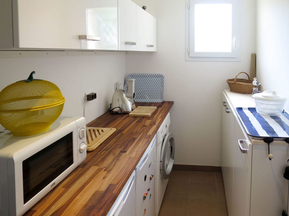 Room, Countertop, Property, Kitchen, Furniture, Yellow, Sink, Floor, Cabinetry, Shelf