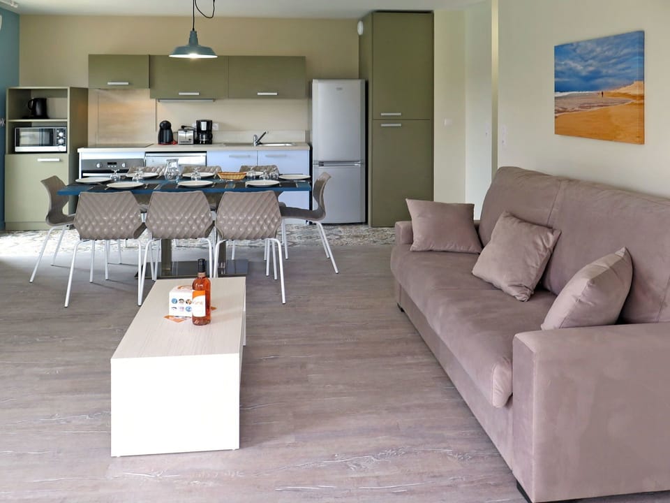 Furniture, Living Room, Room, Floor, Property, Interior Design, Table, Coffee Table, Flooring, Building