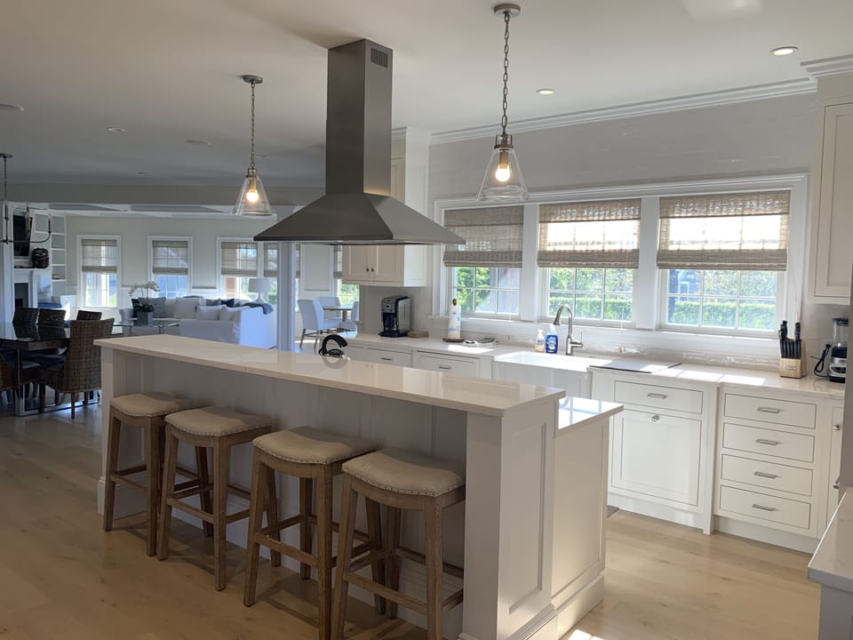 open concept kitchen with views of pool and patio