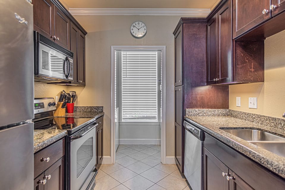 Modern kitchen with full sized stainless steel appliances