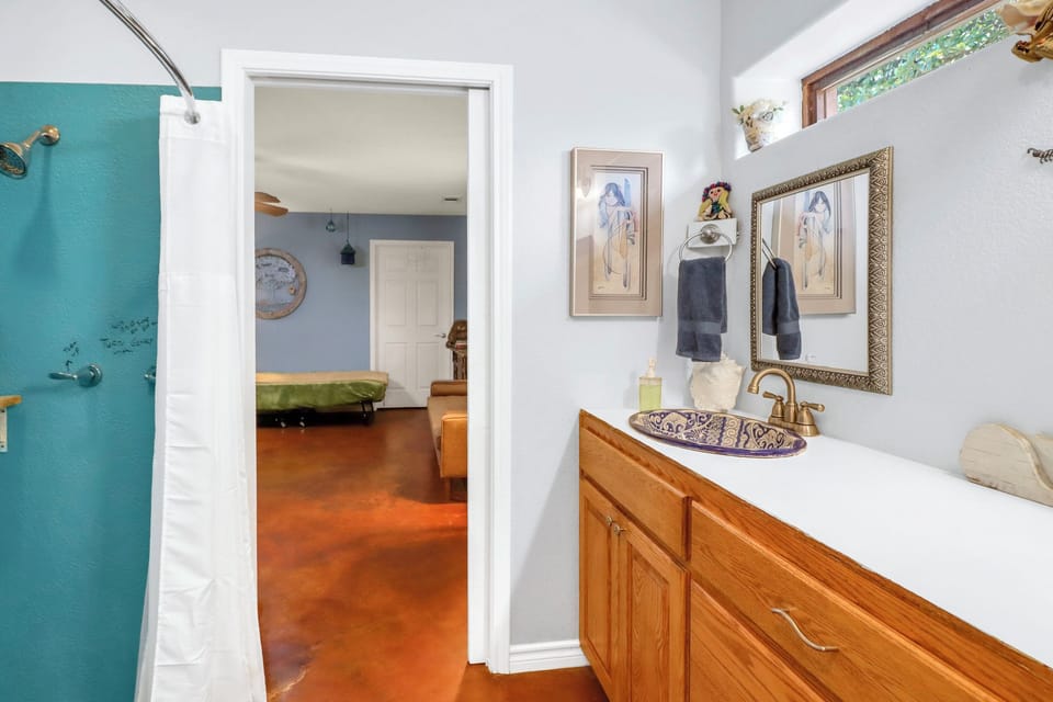 The bathroom is connected the the bedroom