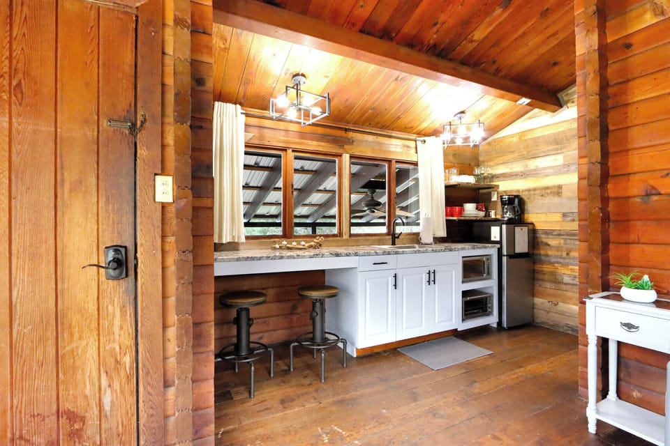 Closer view of the kitchenette showing the bar seating/dining area.
