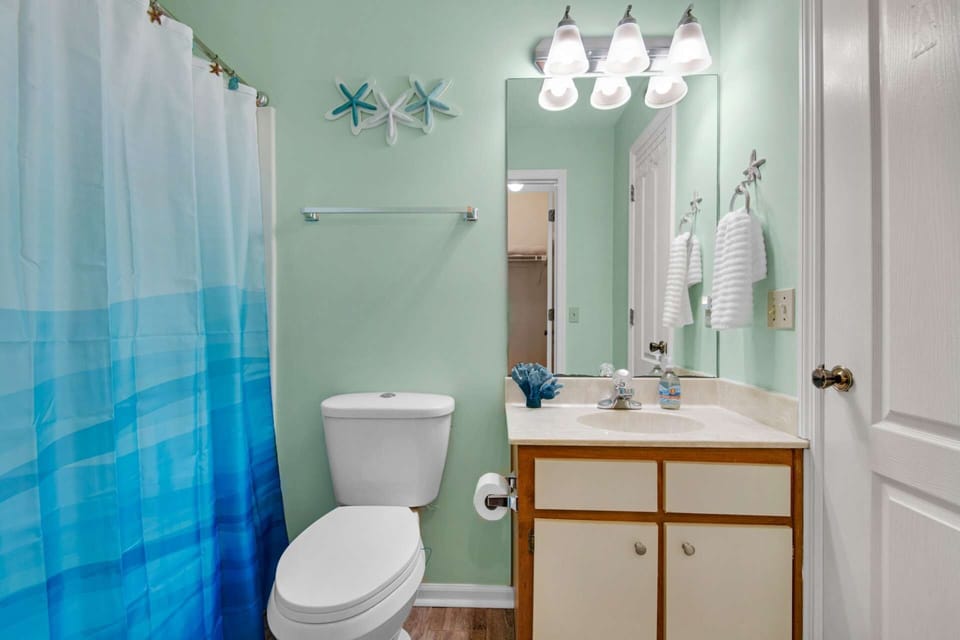 Second bathroom with a shower/tub combination.