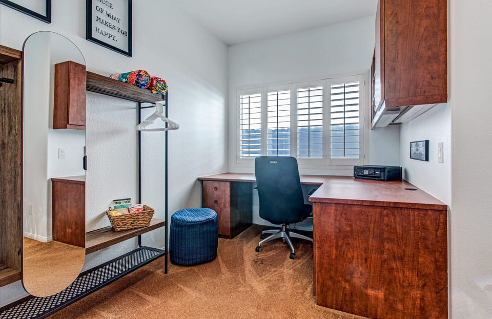 The bunk bed bedroom offers a large desk and small closet.