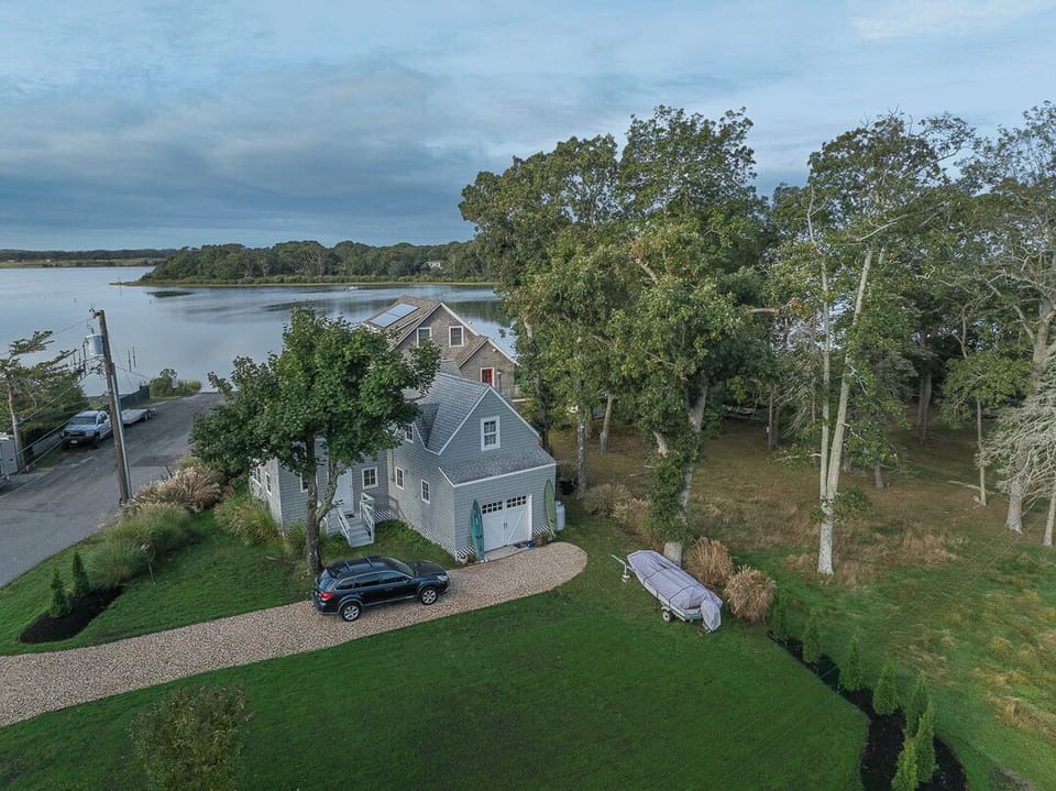 aerial view of house and water view
