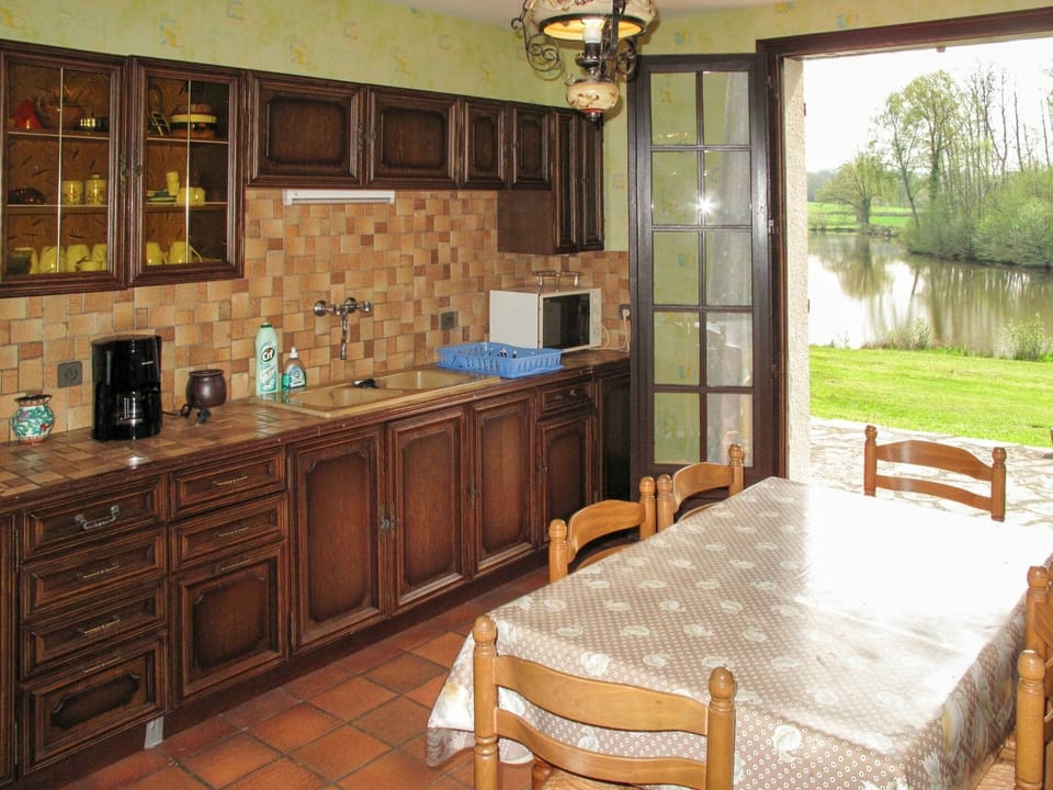 Cabinetry, Property, Furniture, Plant, Table, Countertop, Interior Design, Lighting, Chair, Wood