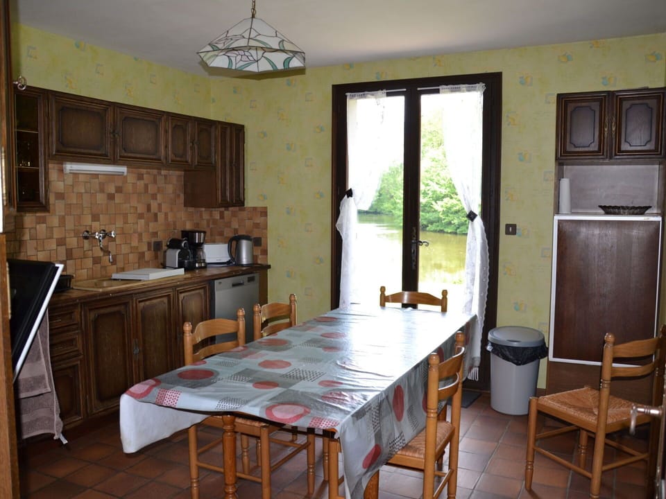 Table, Furniture, Cabinetry, Property, Countertop, Chair, Kitchen Appliance, Wood, Lighting, Kitchen