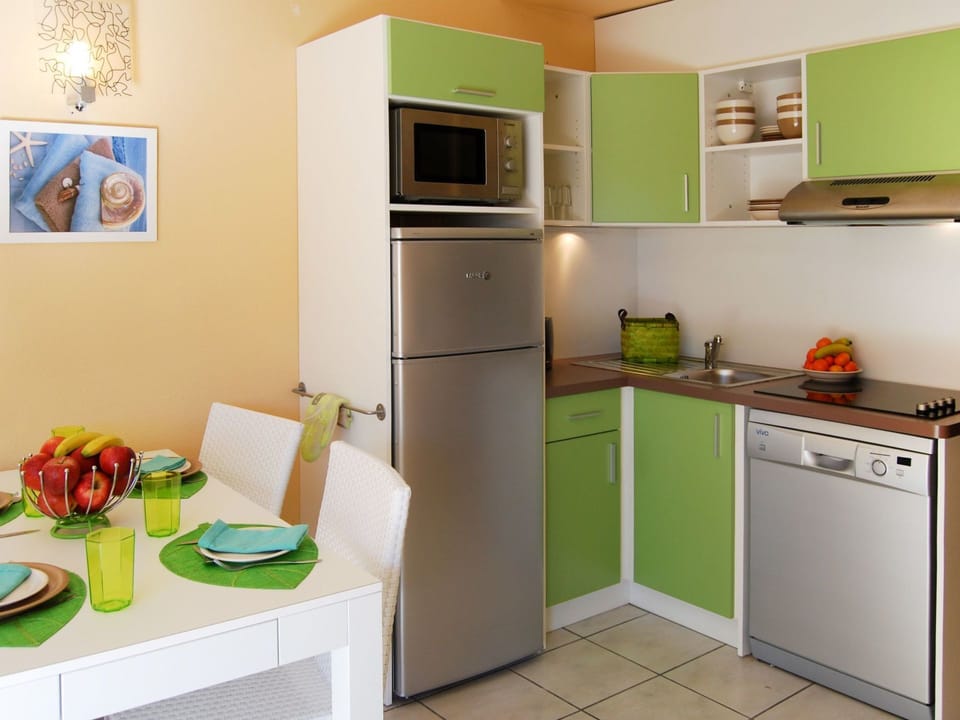 Room, Green, Kitchen, Furniture, Property, Major Appliance, Countertop, Cabinetry, Refrigerator, Yellow