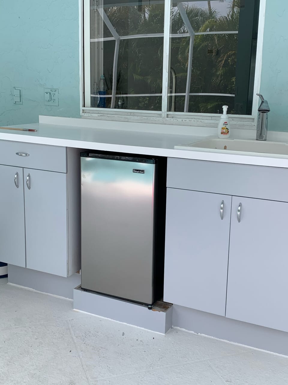 Fun outdoor bar area with new mini fridge and pass through window to kitchen
