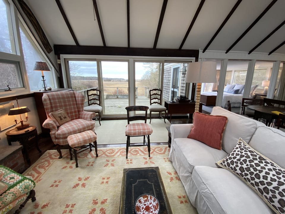 Upstairs living area with Winter views of the upper deck and great marsh.