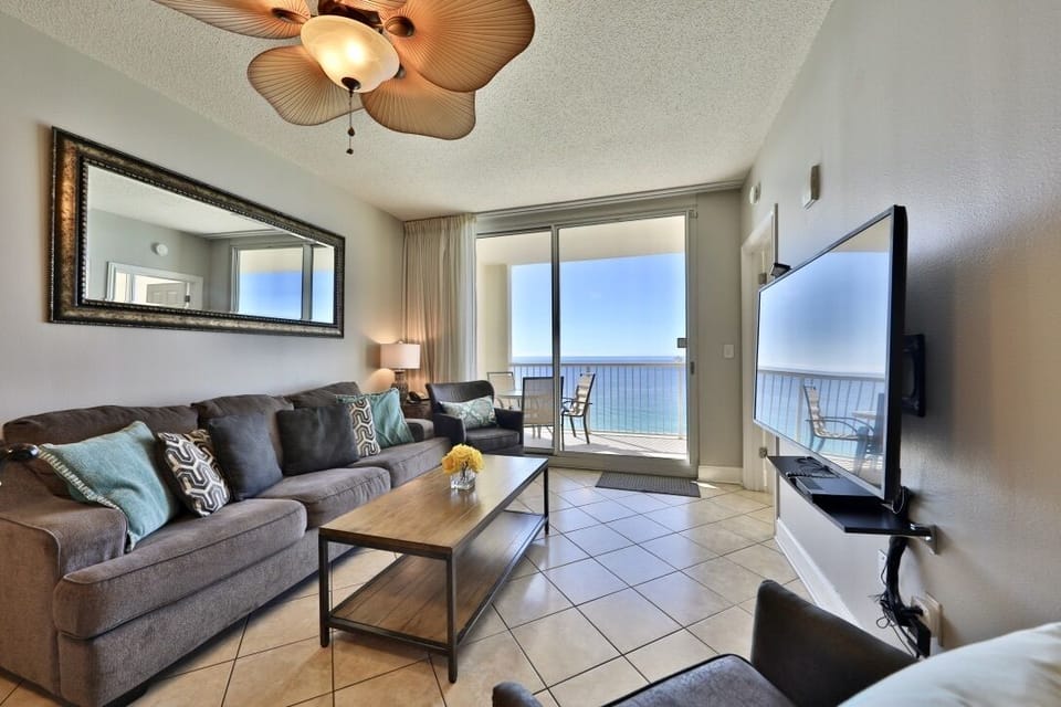 Living room with sleeper sofa and access to balcony