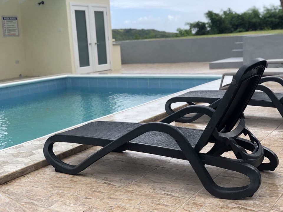 Enjoy the pool area with a view of the ocean. Area for grilling, etc.