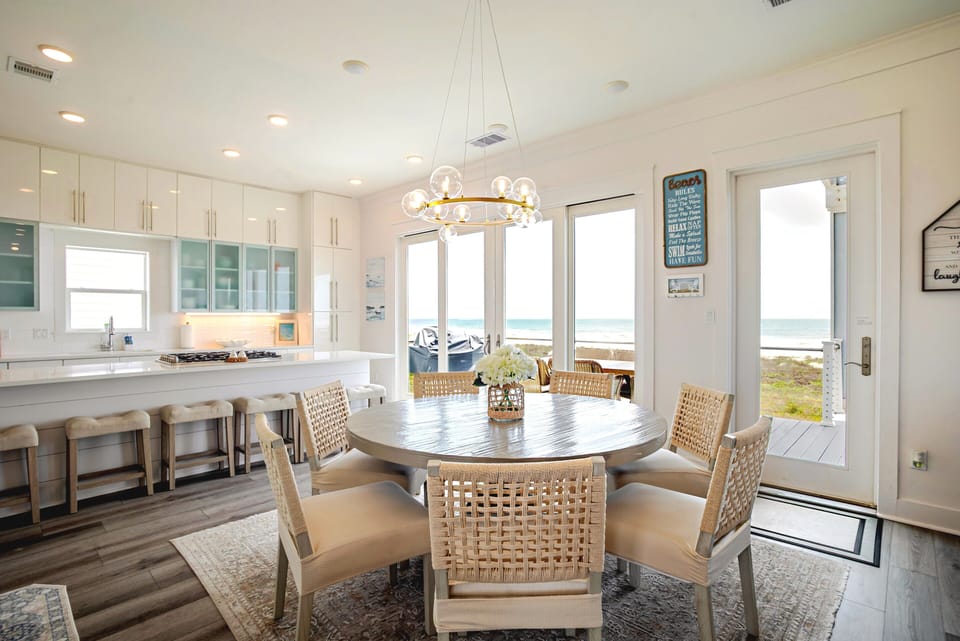 This ocean-view kitchen with 7-seat table and 6 barstools is fun for every.