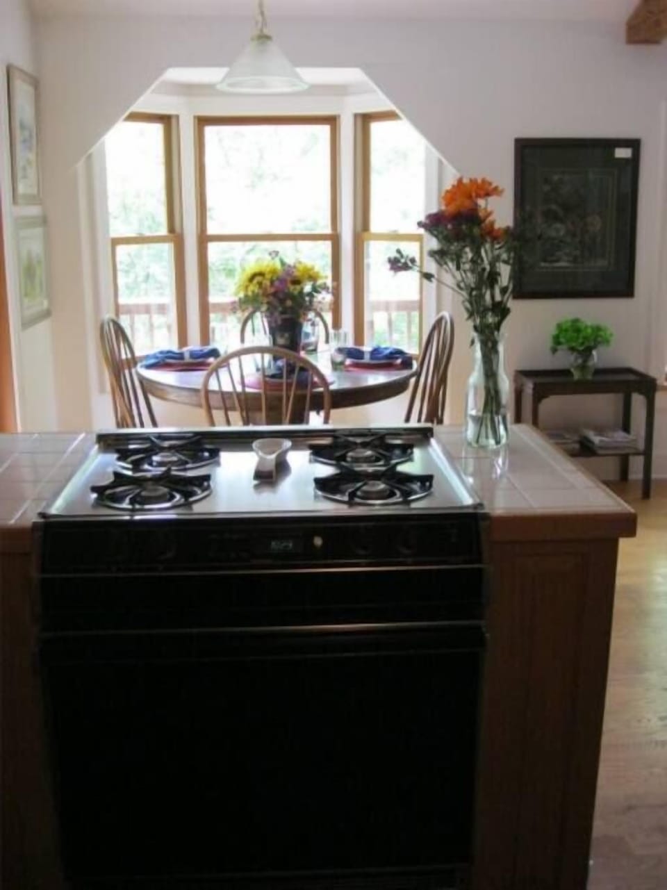 view from kitchen of dining area. open to living room