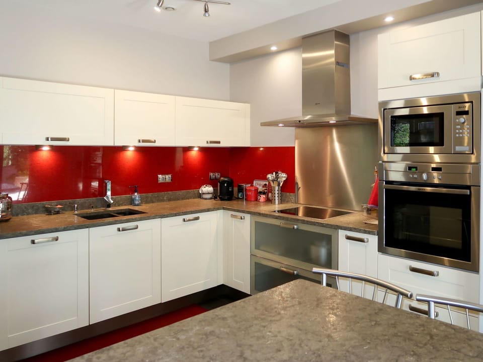 Countertop, Cabinetry, Kitchen, Room, Property, Furniture, Interior Design, Red, Major Appliance, Lighting