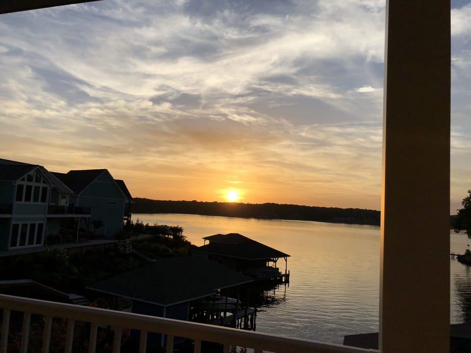 Sunset view from main level out door covered deck

