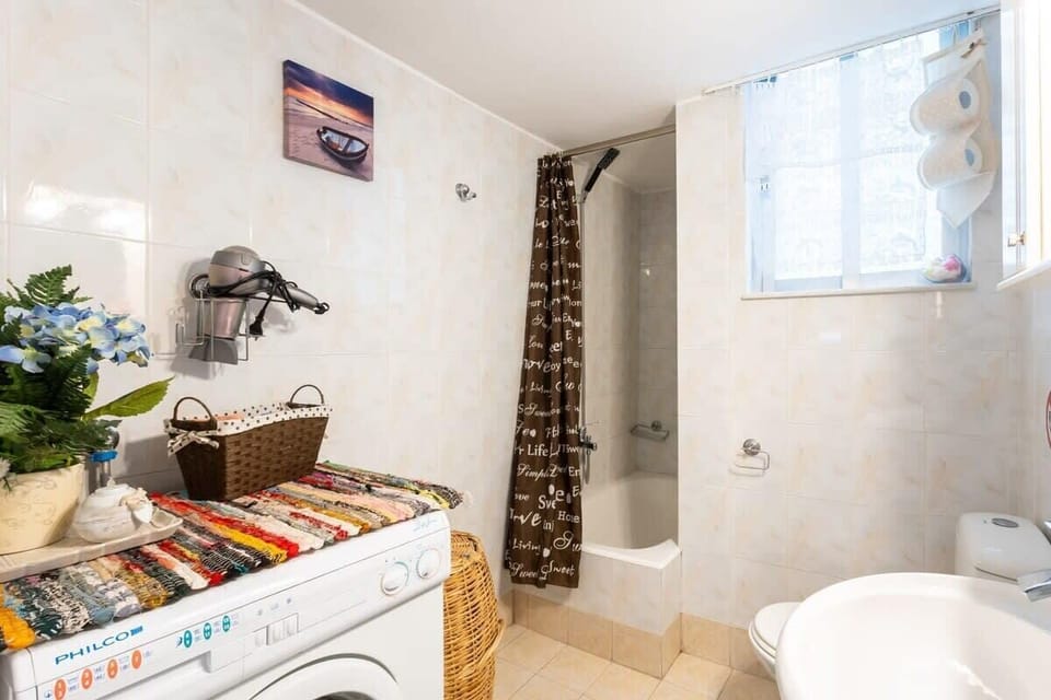 Bathroom – Clean and Fully Equipped with Shower and Storage

