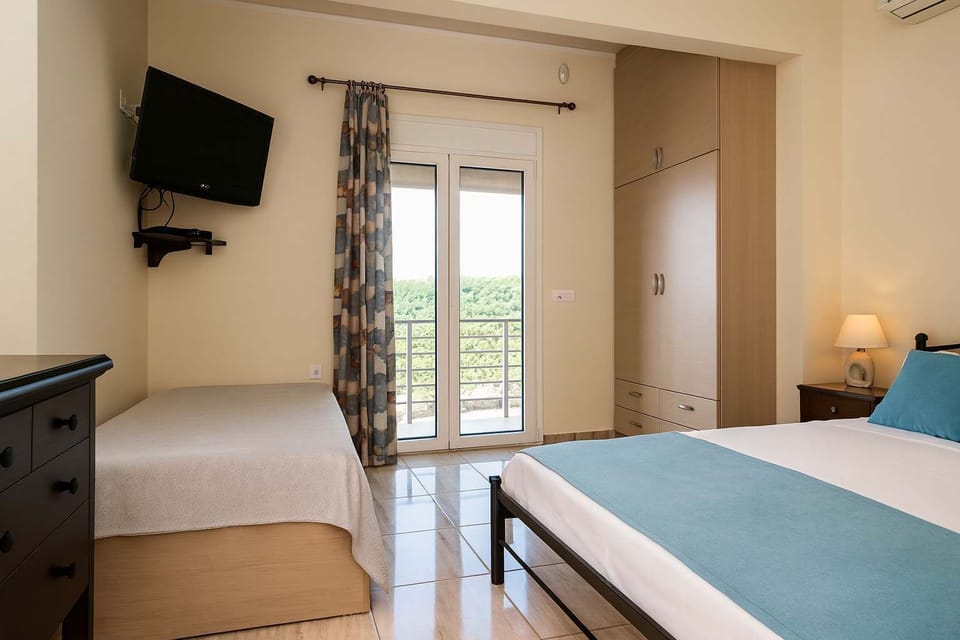 Bright and Comfortable Bedroom Area with Sofa Bed and TV