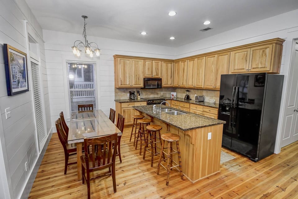 There is plenty of seating at the dining room table and extra seats at the kitchen island