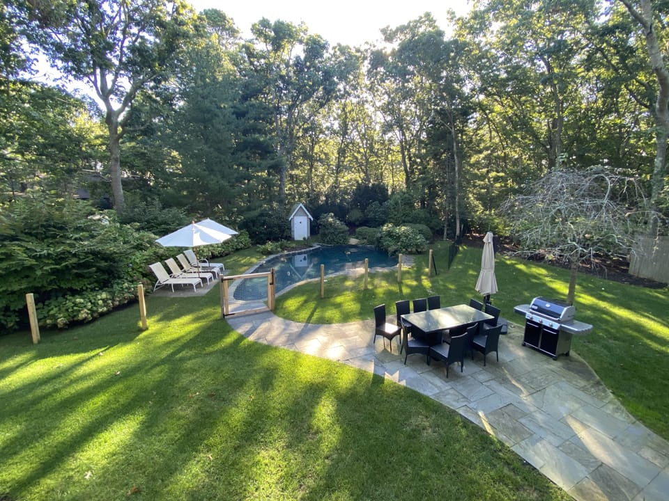Expansive backyard perfect for entertaining; fenced pool safe for kids