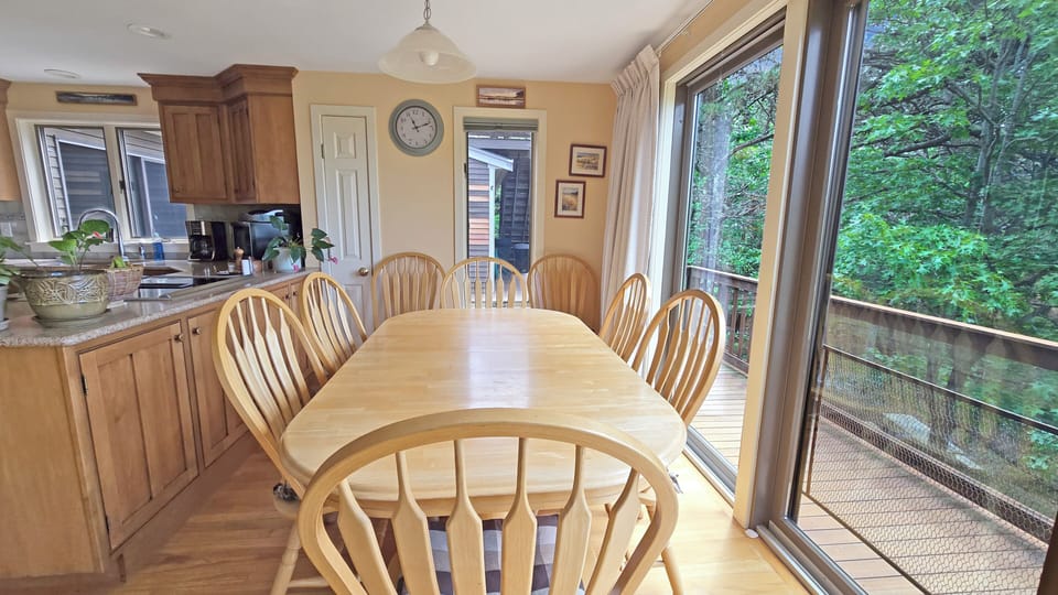 Dining table with slider to upper deck