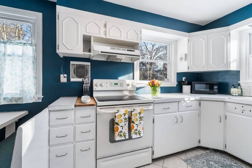Brightly lit kitchen with all the amenities you need for gourmet meals.