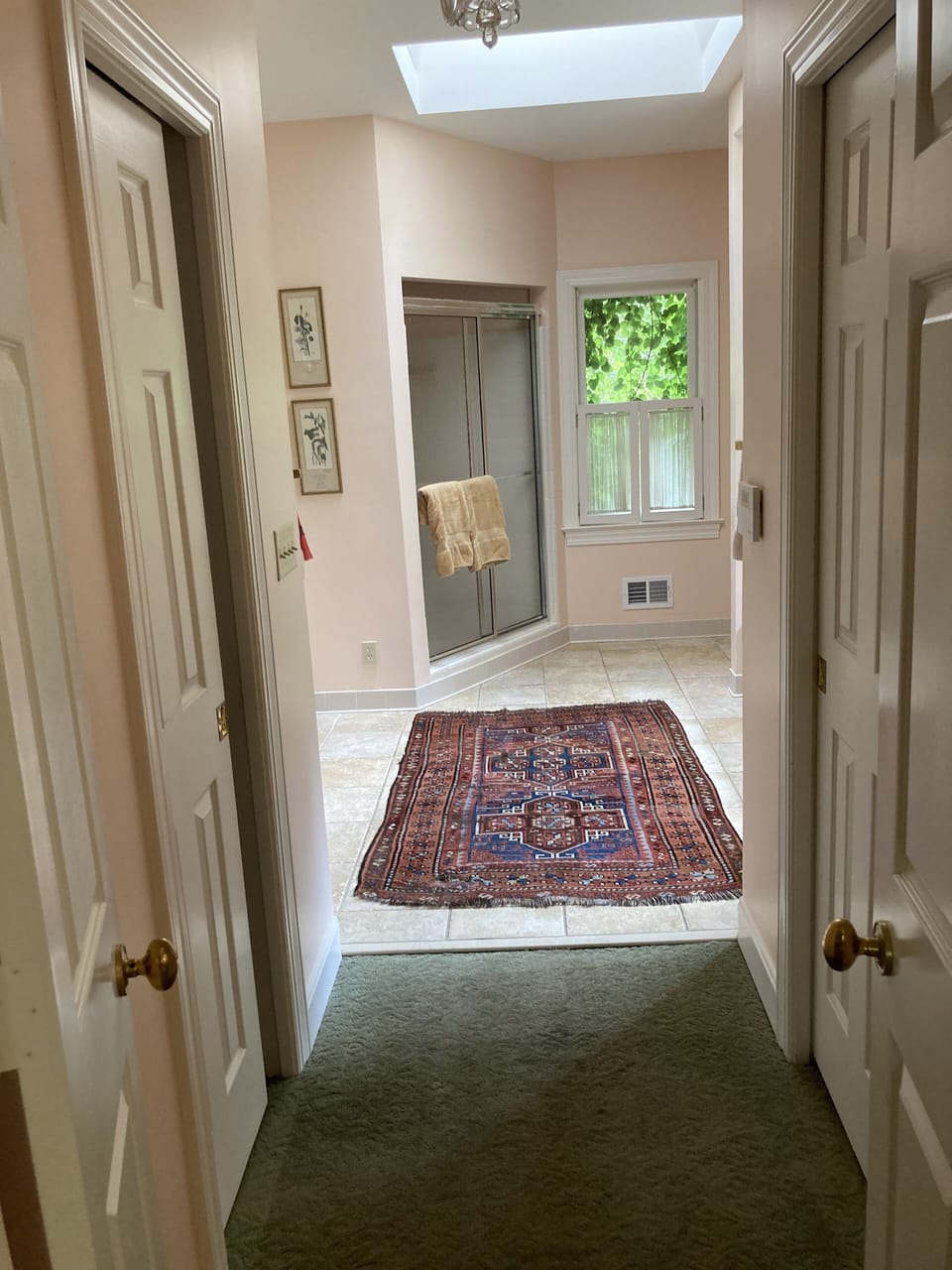 View from primary bedroom into bath. 